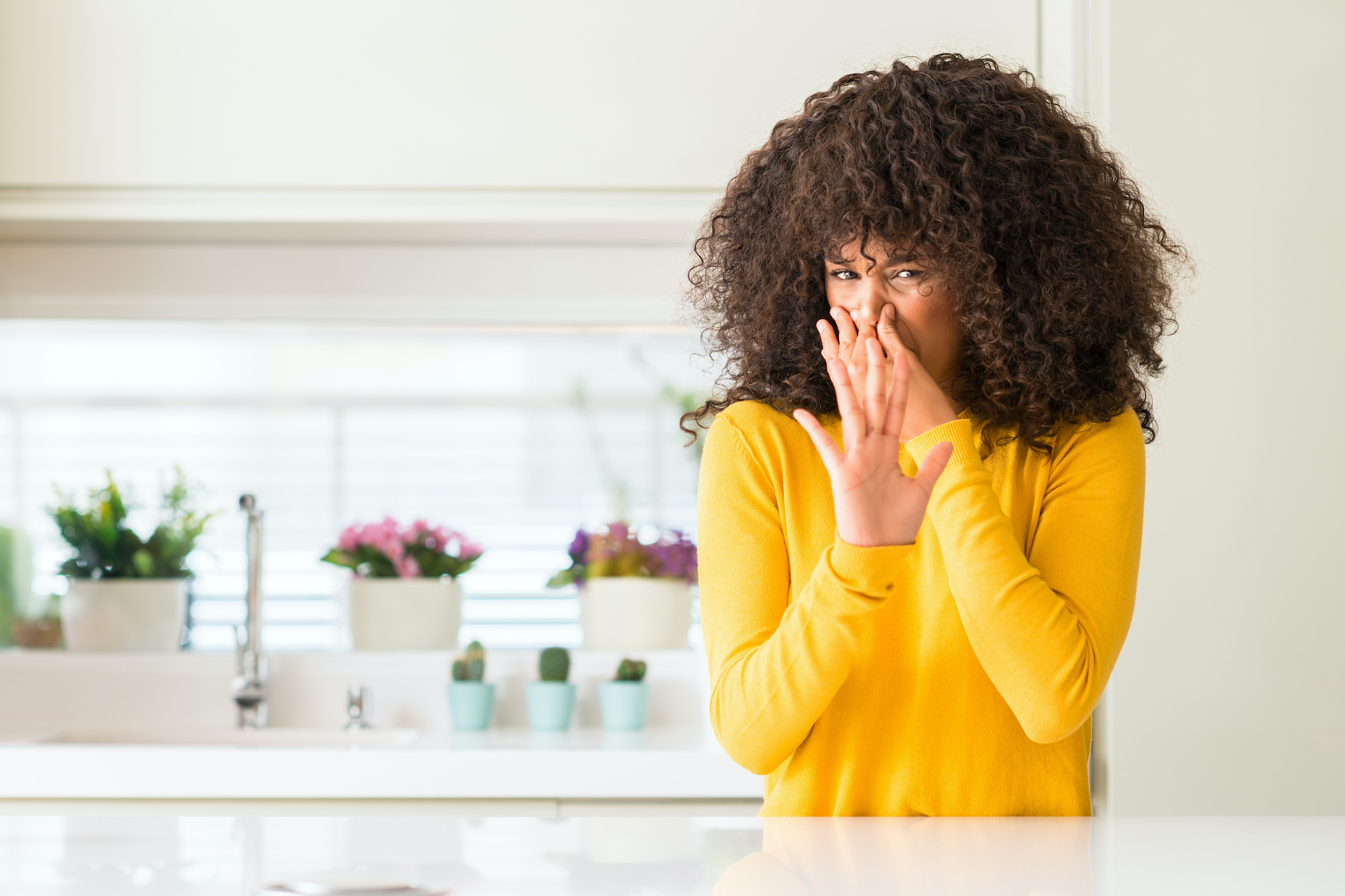 woman pinching nose