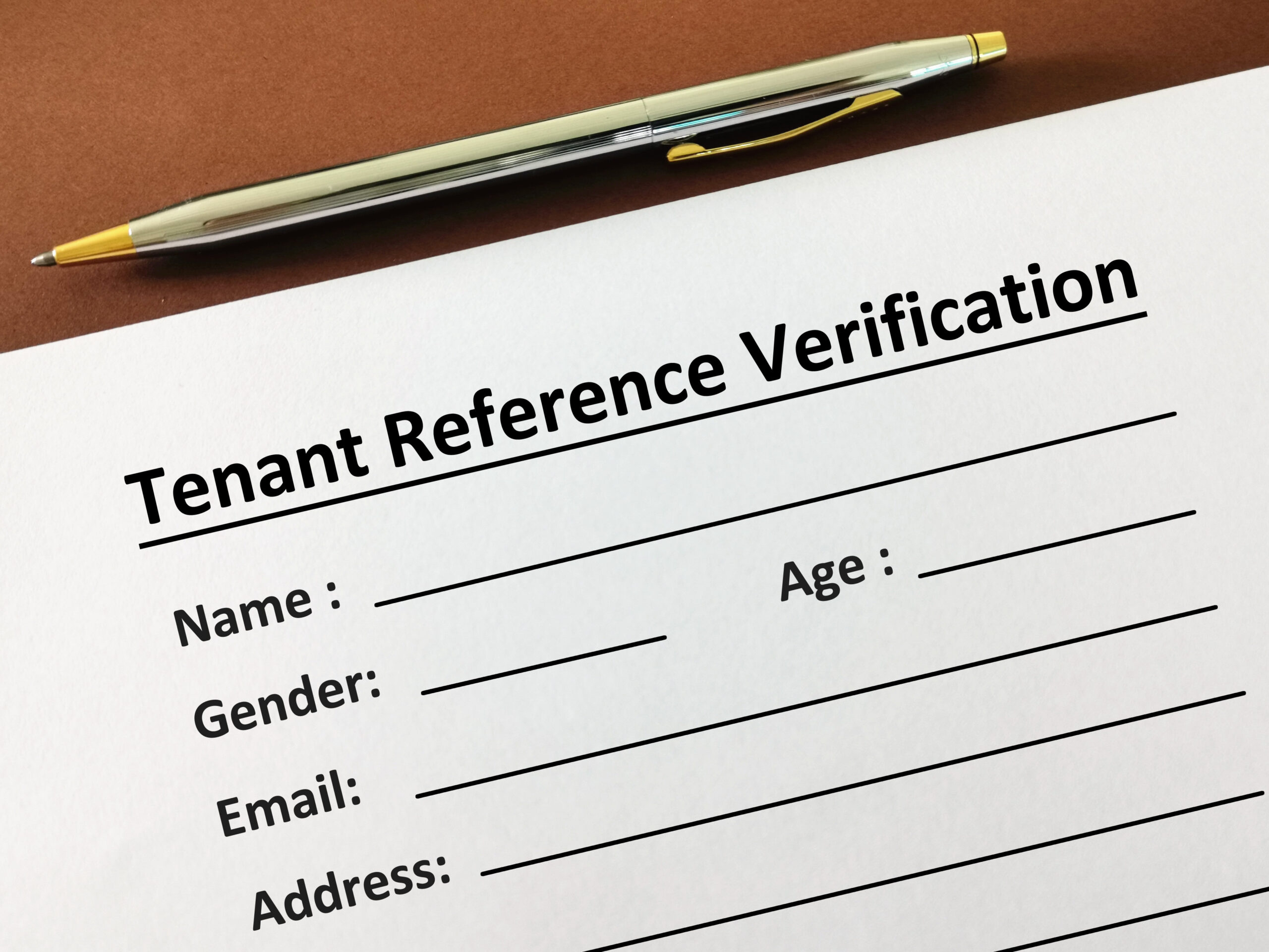 One person is filling up tenant reference verification.